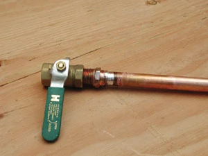 This shows a ball valve with a previously soldered male fitting and pipe.