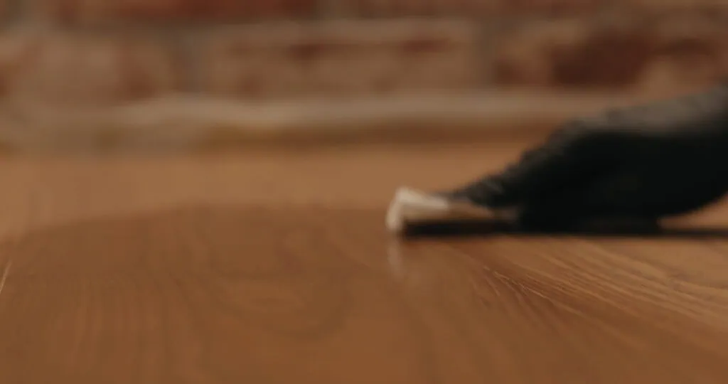 Applying protective oil finish to hardwood floor