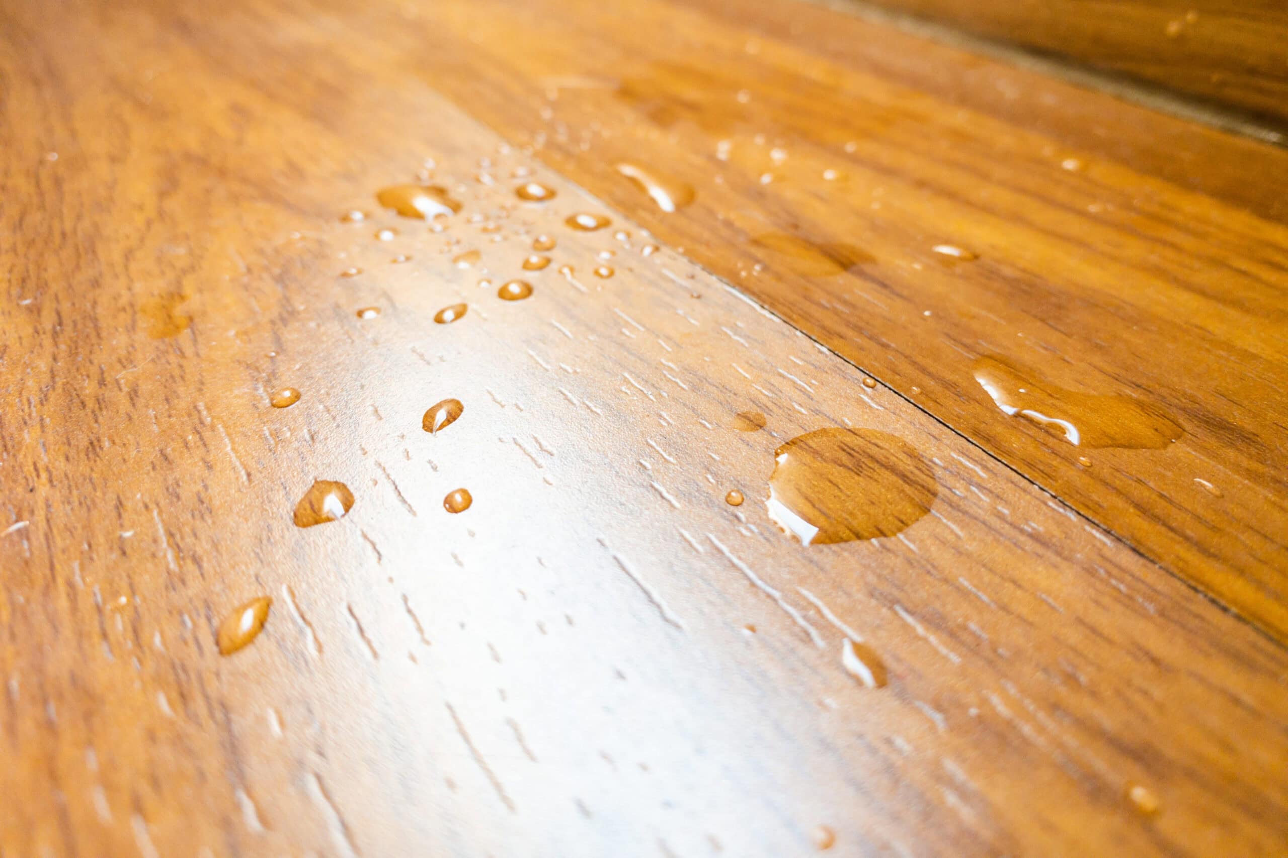 water spill on parquet wood floor