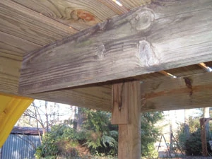 A center joist supports the decking. At the corner support posts, I added some extra blocking to provide a solid nailing surface below the deck boards at the platform's edge.