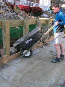 The best way to get the concrete to flow around the post bottoms is to mix it in a wheelbarrow and pour it in. make sure to hose down all posts, sidewalks, grass, etc. after finishing to dilute spillage.