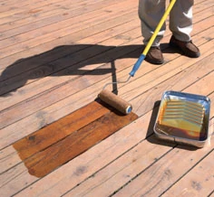 Usually a good oil-based stain can be applied with a brush, roller or sprayer.