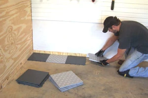 Use 1/4" spacer boards against the walls to create an expansion gap.