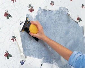 Allow the stripper to work for about 20 minutes, and then use a scraper to remove the loosened paper. The Zinsser Paper Scraper Wallpaper Remover and Wall Scraper has an angled blade and large handle, allowing you to scrape off stubborn sections of paper without damage to the wall surface.
