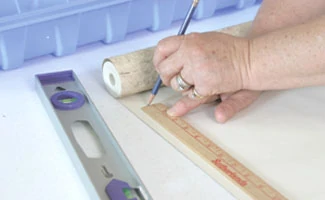 Roll the paper out on a long table and measure for length, adding for the top and bottom.