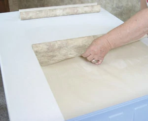 It's best, however, to use an additional adhesive, such as Zinsser PREPZ One Step Wallpaper Prep and Adhesive. Apply with a brush or roller, then fold the wallpaper back to itself (paste to paste), and continue to apply to the remainder of the strip.
