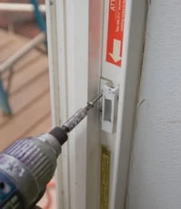 Don't forget to remove the latch mechanism from the door frame. Properly installed, the long screws go through to the framing, which means they must be removed to release the frame.