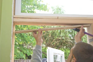 This required adding a piece of furring on the underside of the horizontal framing board to properly back the window flange.