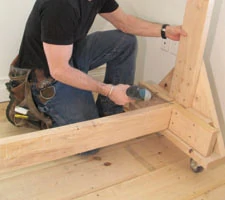 Pack out the angle braces with 6" blocks, then laminate with 2x6 shelf support blocks.