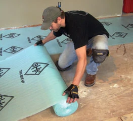 Unroll the foam underlayment and join the butted seams with duct tape.