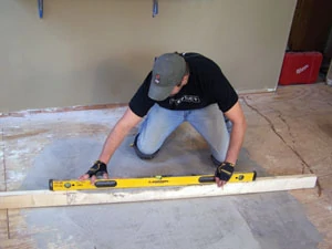 Make sure the subfloor is level. The floor shown required a Portland cement-based leveling compound.