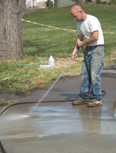 A water hose with good pressure is the preferred method for washing exposed aggregate.