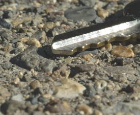 A close-up view of this exposed aggregate walk looks like loose gravel. I tried dislodging some of these rocks with a key but they were all well bonded in place.