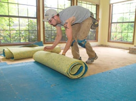 The carpet pad can usually be rolled up as it's being removed.