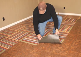 Adhesive discs, included with the carpet squares, are all that's required to hold the Flor tiles in place.
