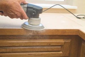 When preparing countertops for laminate, sand everything flat and smooth including seams and the self-edge connection.