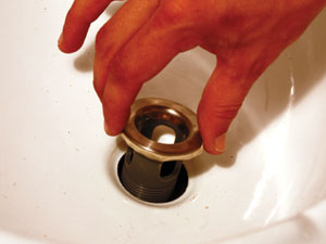 11. Seat the new drain cap into the sink hole.