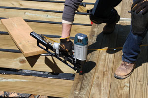 0 1a1a1DeckCheckTT07 A pneumatic framing nailer with ring-shank nails can make quick work of installing a pressure-treated deck.