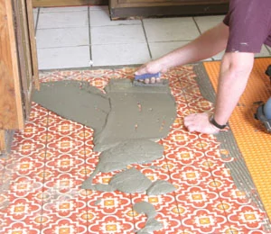 Tile is set in the same manner as for other underlayments, except the thinset mortar is mixed a little thinner.