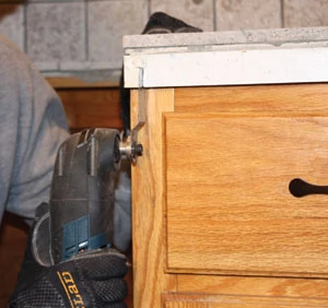 An oscillating tool with a plunge-cut blade can make precise notches in trim carpentry, cabinets and countertops.