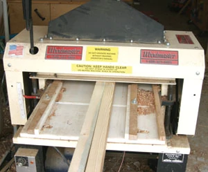Using a jointer of planer, smooth and cut the sawn edges to create a 1-1/2 inch width.