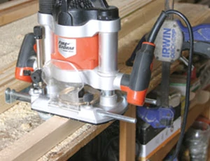 With a plunge router, route a 1/4-inch deep by 3/8-inch wide dado on the inside surfaces of the leg posts. Stop the dado at the location of the top of the bottom leg ends.