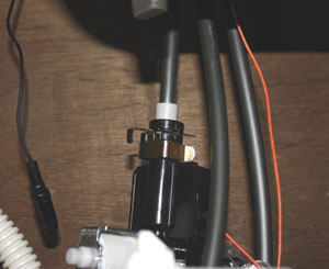 The solenoid connects to the valve outlet with a special metal clip.