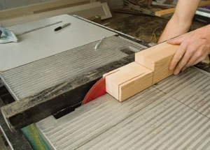 Repeat the process of using the table saw to remove extra material around the tenon; being careful each time to stop the cut at the mark on the table saw surface.