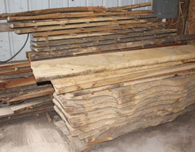 In most cases, wood must be dried before use, especially for furniture and cabinetry. Air drying is an ages-old and effective method of drying wood. Any dry area with plenty of air circulation can be used. I've used a barn for many years.