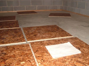 Lay out the floor to determine what cuts you'll have to make at the perimeter walls.