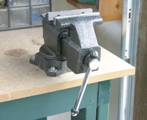 Vises for both metal and woodworking are extremely important. They should be located on sturdy benches or work surfaces.