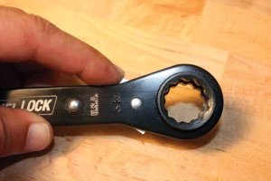 A trigger on the Channellock wrenches reverses the ratcheting direction.