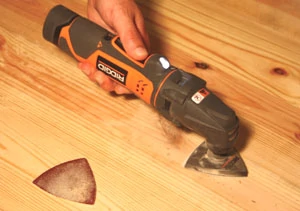 The Ridgid JobMax oscillating tool features a removal head for an interchangeable body that connects to different tool heads.