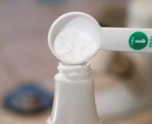A few teaspoons of baking soda in a spray bottle of water makes a good battery cleaning solution.