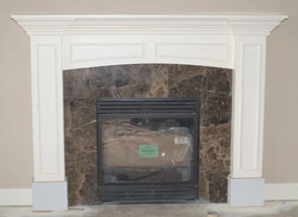 Mantel completed with surround in place. After the stone surround is in place, mill a 1/4"-thick piece and bend it into place on the underside of the arc.