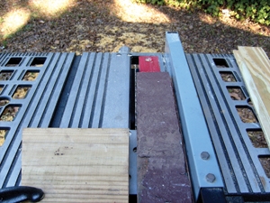 One of the old boards was used as a guide to determine the width of the replacement boards.