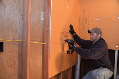 The lightweight Schluter-KERDI backer-boards can easily be screwed to the wall studs with no pre-drilling required. The material can also be cut in places with a utility knife-no power tools or special blades required.