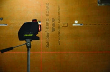 A Bosch laser level was used to guide the tile and ledger layout.
