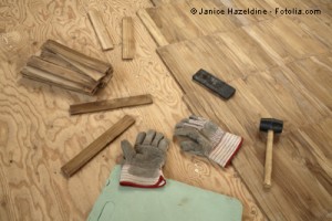 Laying wooden parquet flooring.4 When your family needs a larger house, consider doing what property owners in affluent neighborhoods often do: Build an addition onto the home.