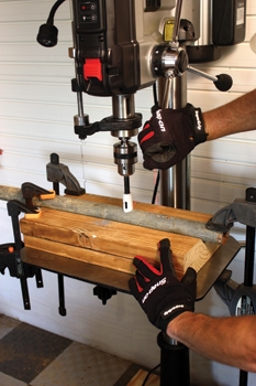 Simply clamp the pipe jig to the table and use the V-notch to prevent cylindrical objects from rolling when drilling.