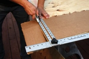 Cut a cardboard template to the same width as the plywood frame. The height of the template must be large enough to encompass your corner cuts.