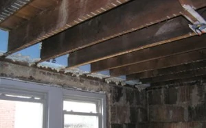 While the walls are open, the time is right for sealing the building envelope in areas you might not think of, such as along the ceiling joists.