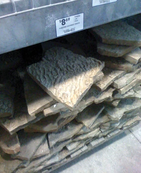 There wasn't enough leftover stone to complete the border, so I went to the home center to check into the readily available supply. After seeing the price per stone, I left empty-handed.