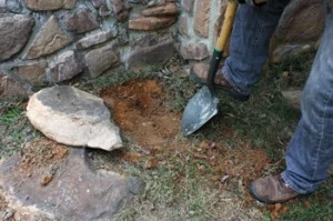 To keep the top of the row relatively level, I had to dig a trench for some of the stones to sit slightly below grade. Recessing the stones into the ground also adds stability to the garden border.