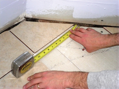 Dry-fit every single piece of tile for the entire room making sure that you use tile spacers while doing this.