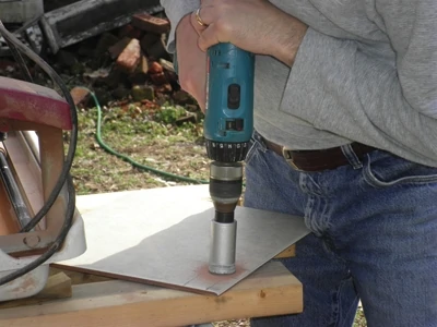 A carbide tip bit is the best way to drill small holes in tile, and a 1-3/8" carbide tip drill bit is good for larger holes for supply lines.