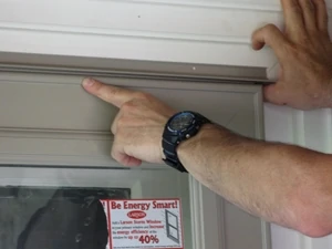 Set the drip cap with an even reveal above the door.