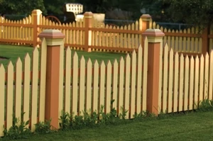 A bold, two-tone color scheme, large posts and curved picket arrangements offers several ideas to out-of the box picket fence designers.