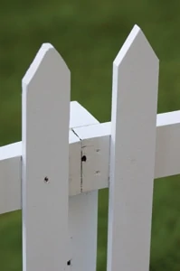 In the hidden-post design, the fence rails are mounted on the outside of the post and are joined together on the post.