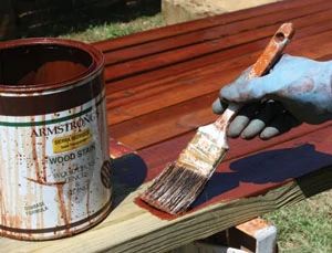 Depending on the condition of your lumber, you may be able to save time and labor by staining the wood prior to assembly, as in the case of the deck handrails shown.